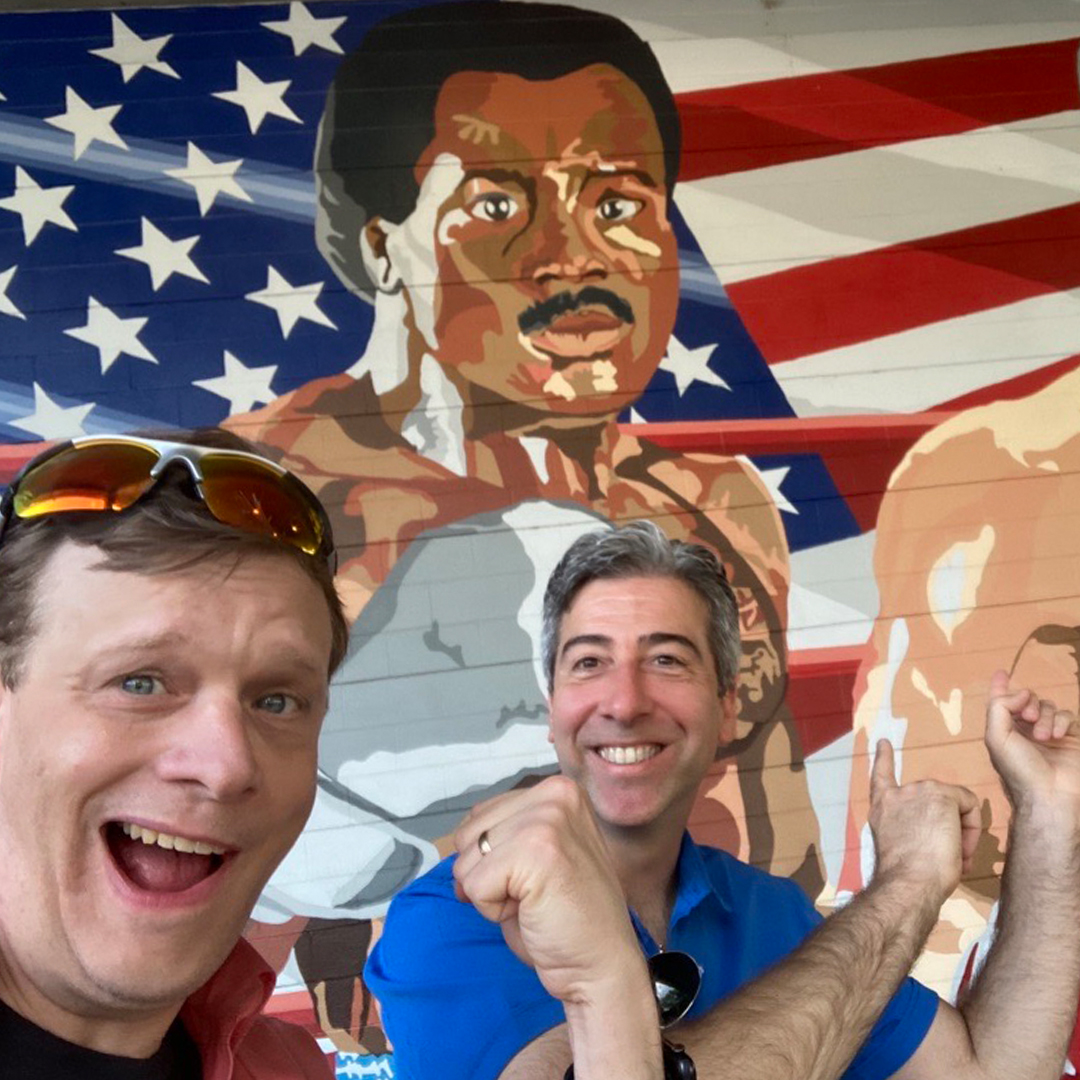 Tom Tumbusch and John Acquavita in front of the Apollo Creed and Rocky Balboa Mural at Drake's Gym